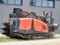 Directional drill machine, drilling technology. Horizontal directional drilling machine, HDD drill rig. Drilling rig stands on sidewalk. Trenchless installing underground utilities - pipe or cables
